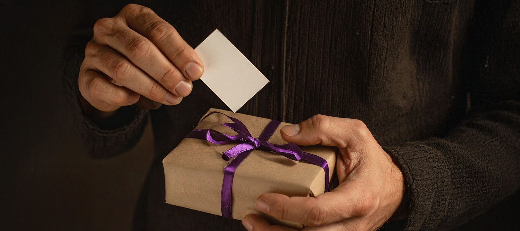 Man receiving a thoughtful gift in his den