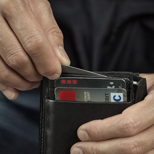 A credit-card sized multi-tool tucked into a wallet